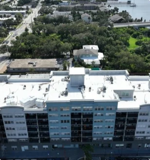 Aerial view of several commercial buildings with flat roofs.