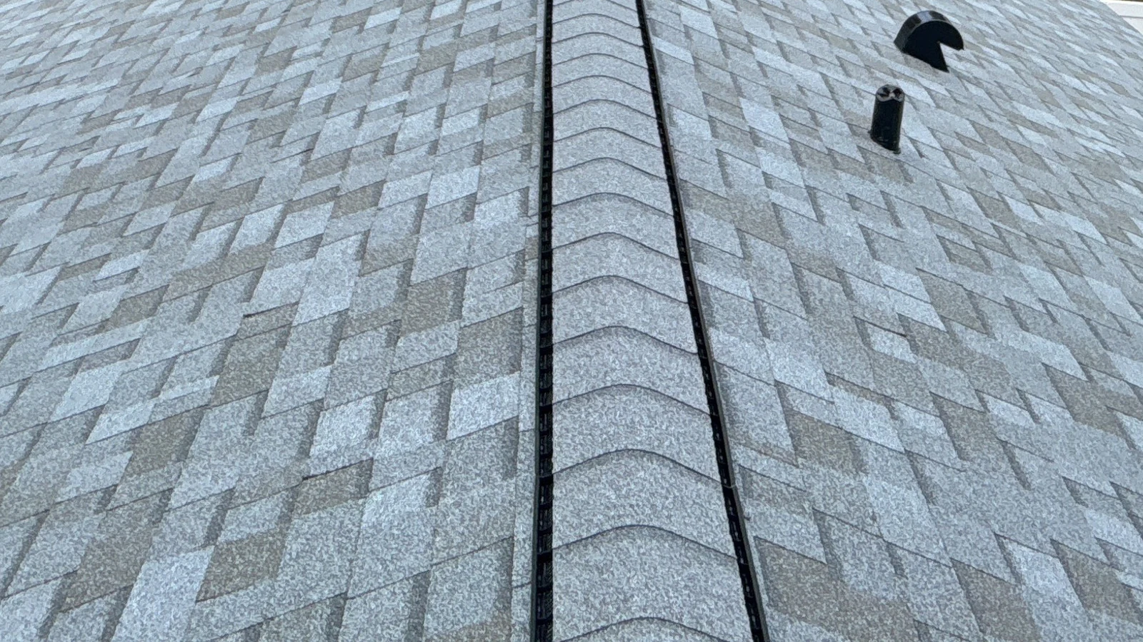 Roof-level view along the completed Estate Grey Owens Corning Duration roof in Apopka