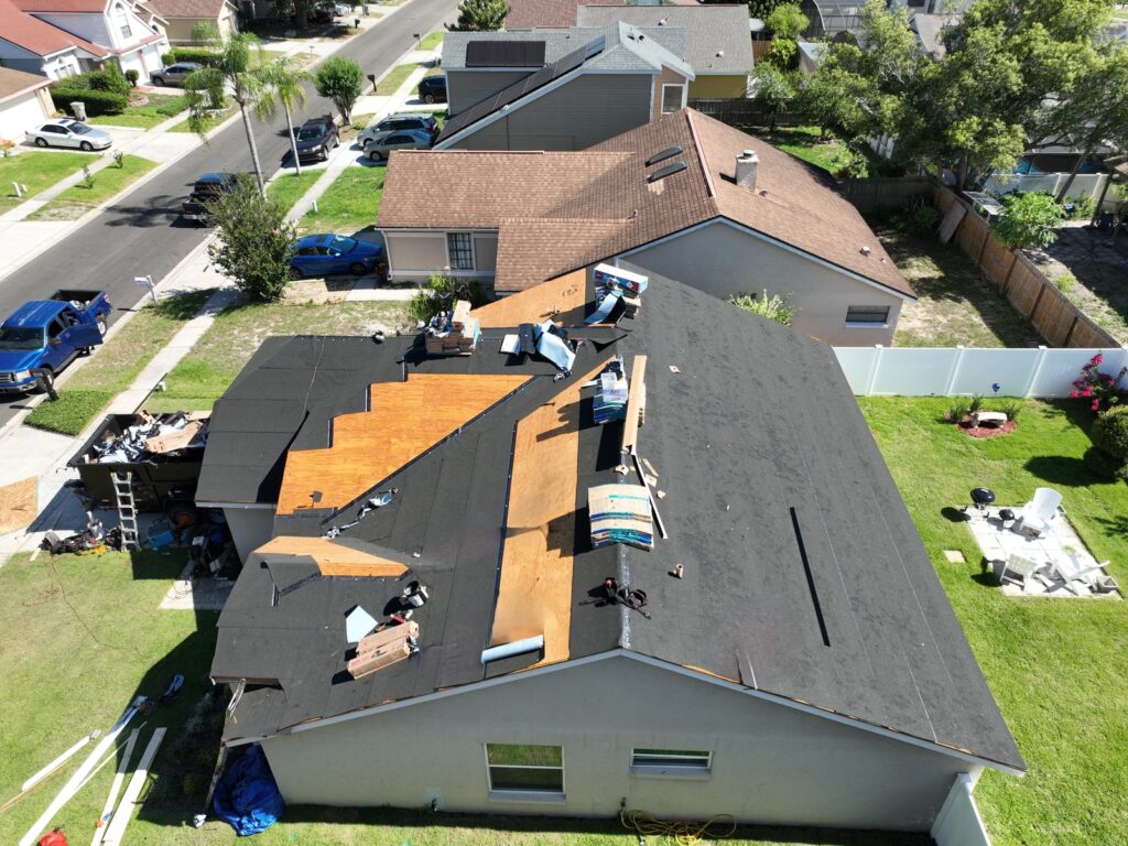 Shingles being installed on the Apopka home