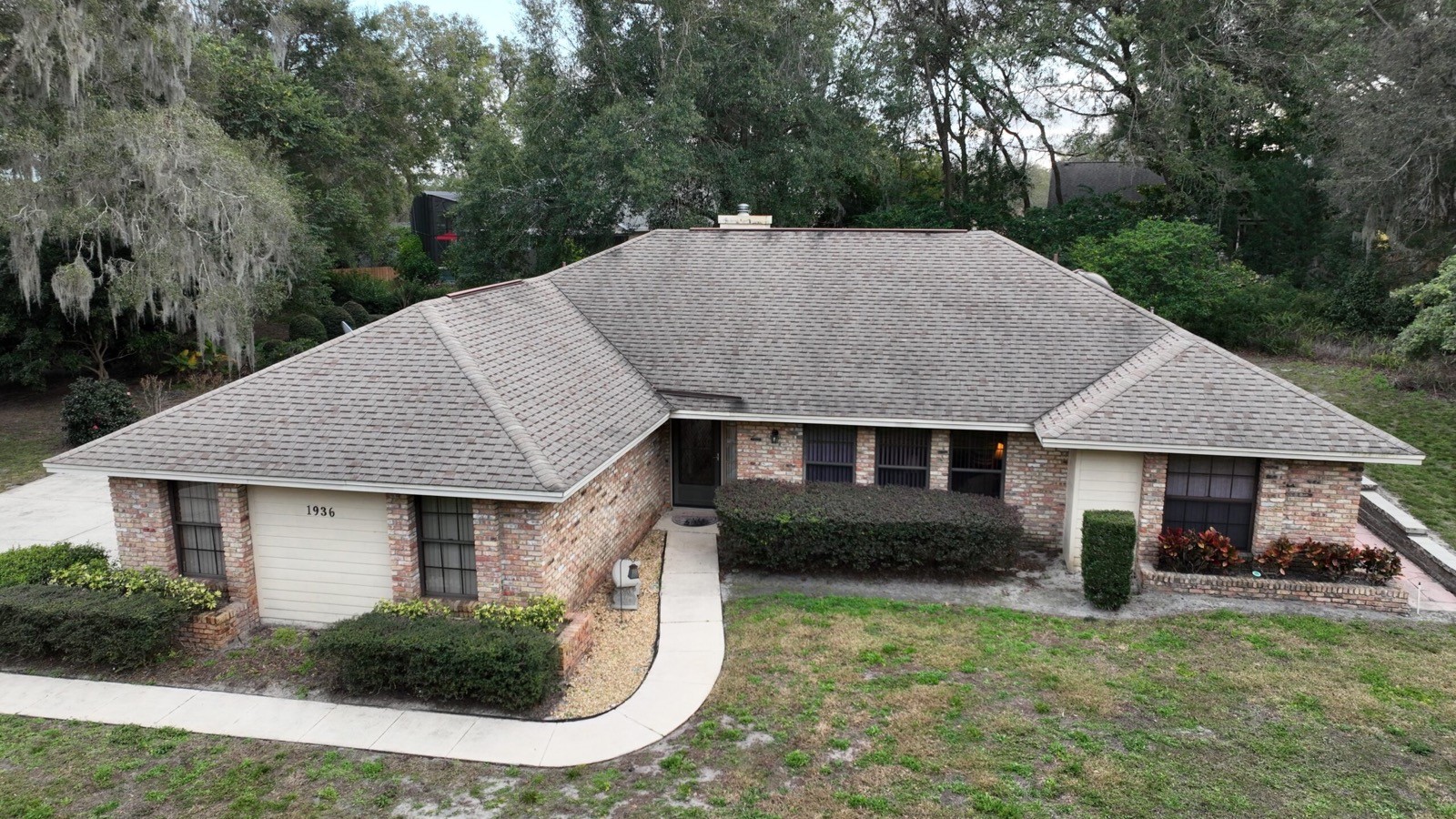 Aerial view of a Florida home with a shingle roof