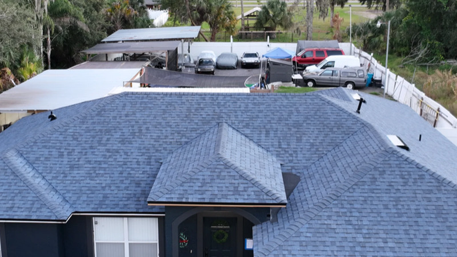 Roof-focused view of the completed Harbor Blue Owens Corning Duration roof in Bithlo