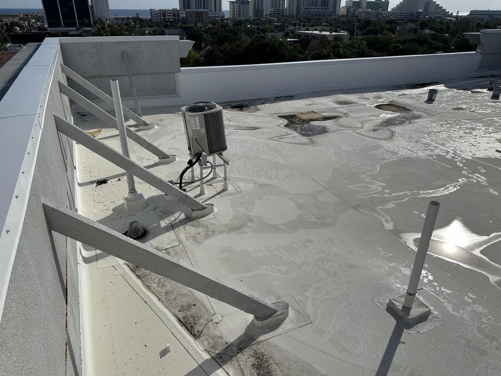 Lifted roofing on the Daytona commercial roof before replacement