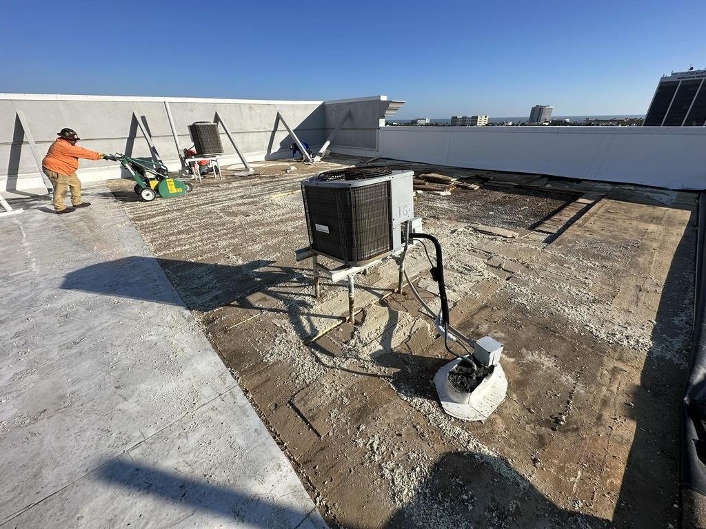 Old commercial roofing being removed in Daytona