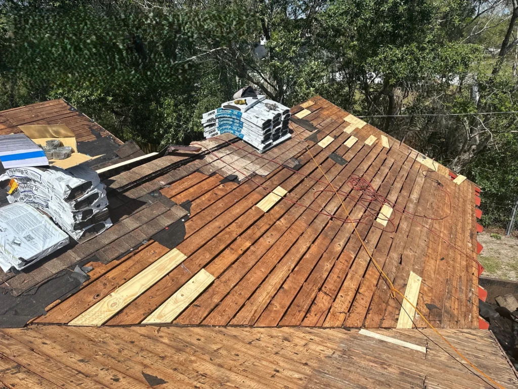 Older wood roof deck with replacement boards during the DeLand project