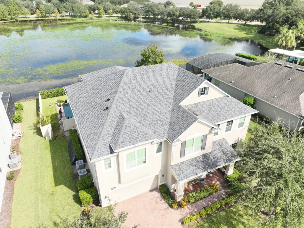 Aerial view of the completed Magnolia Park Estates roof and nearby water