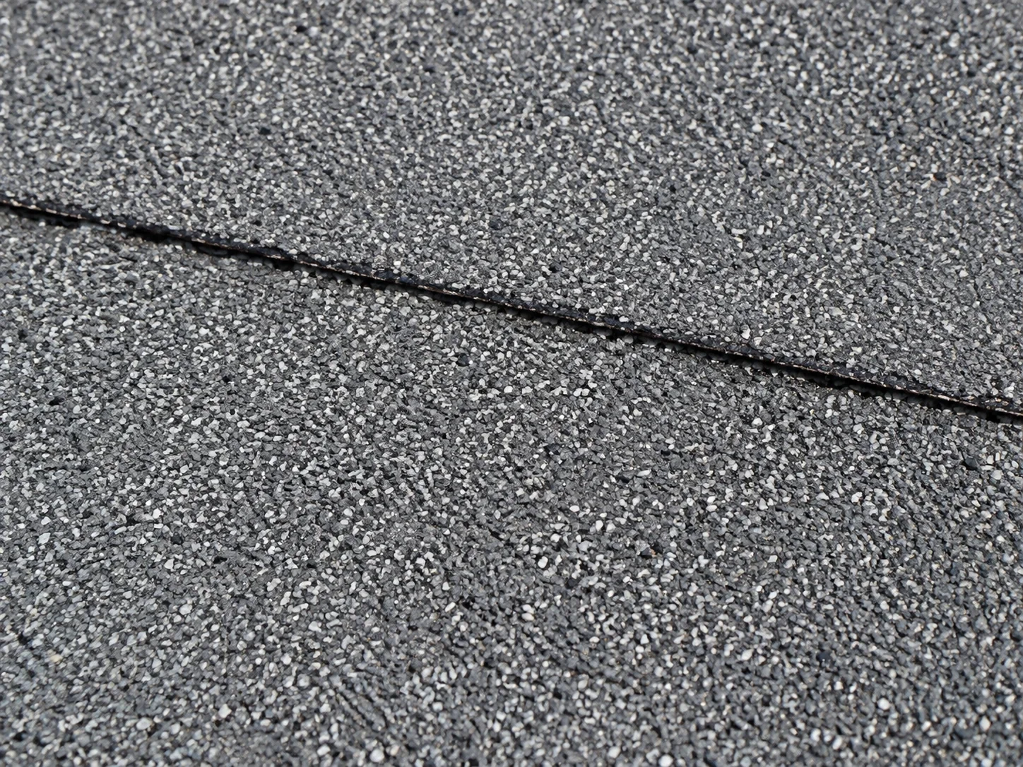Granular modified-bitumen roof surface and overlapping lap.