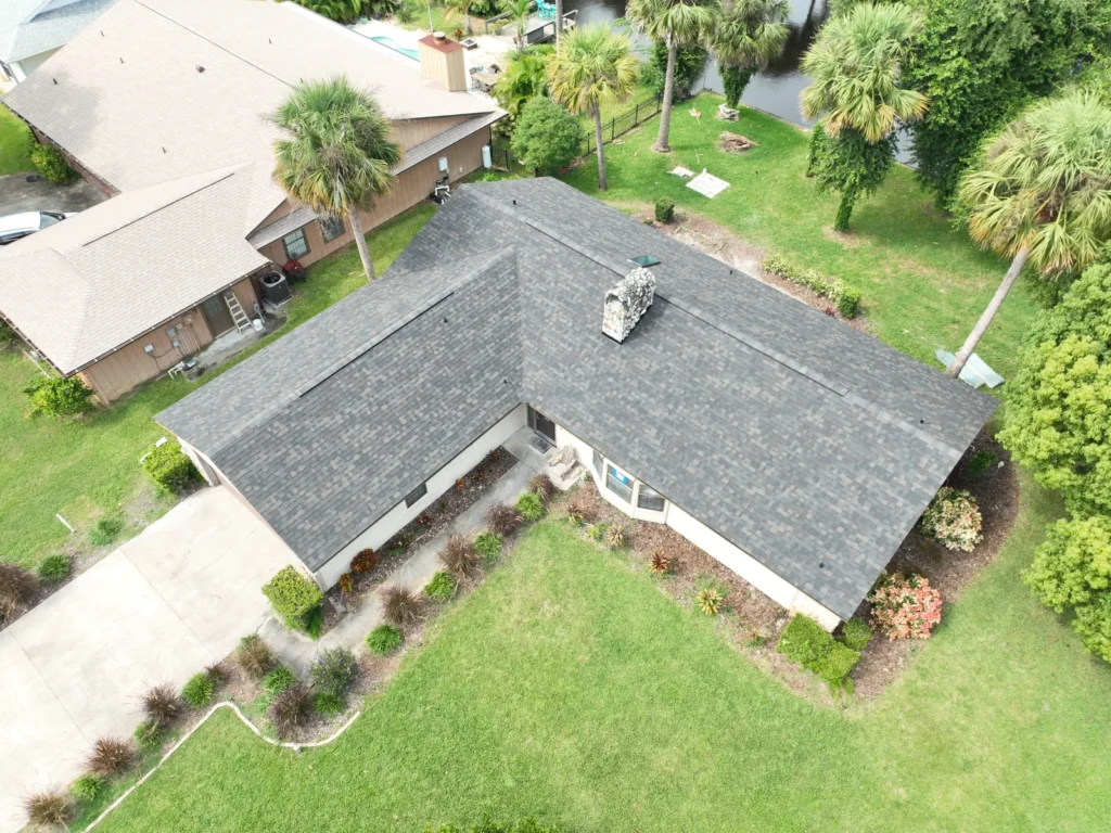 Side aerial view of the completed New Smyrna shingle roof