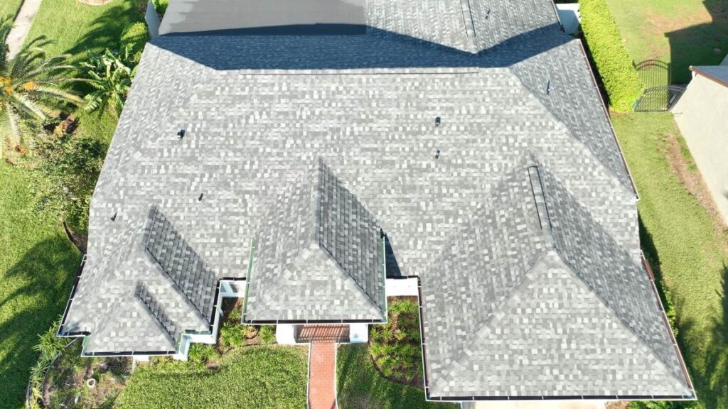 Aerial view of the completed shingle roof and gutters on an Ocoee home