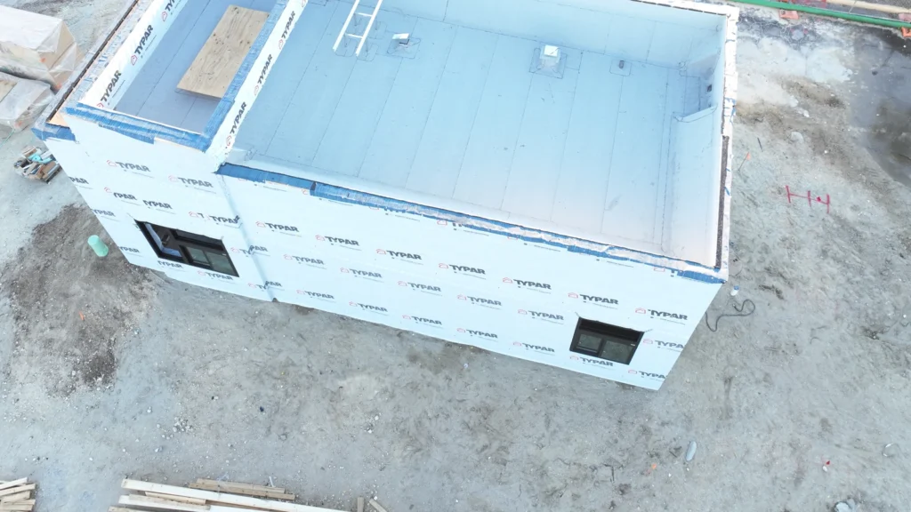 Roof-focused aerial view of the modified bitumen roof on the Ormond Beach commercial new-construction project