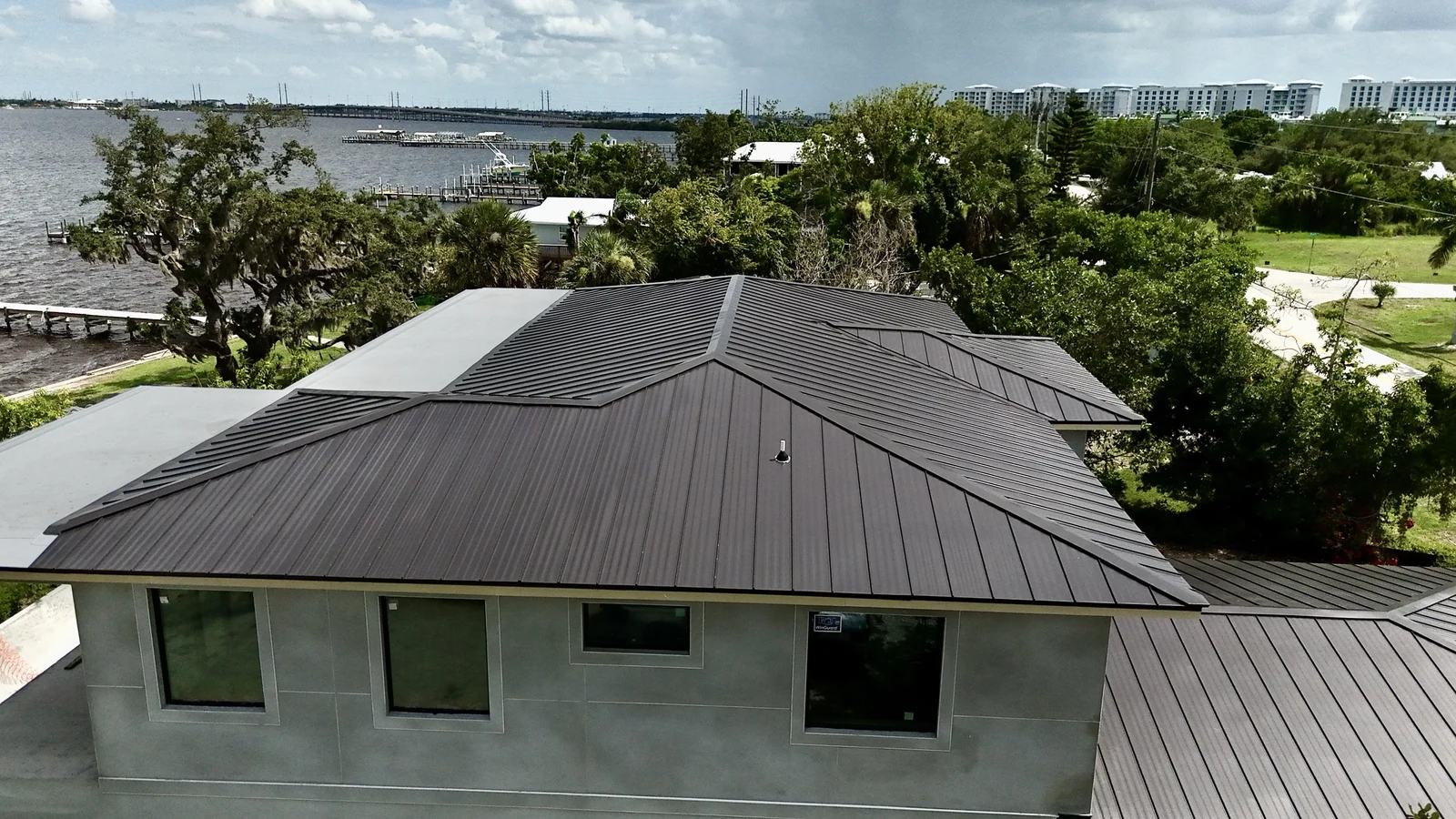 Front aerial view of the completed Port Charlotte standing-seam metal roof