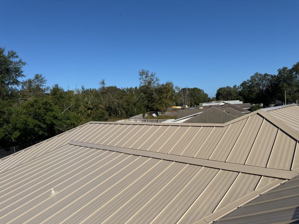 Close view of the completed standing-seam metal roof panels