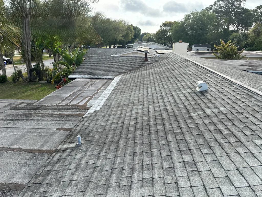 Older shingle and flat roof surfaces before the Rockledge replacement