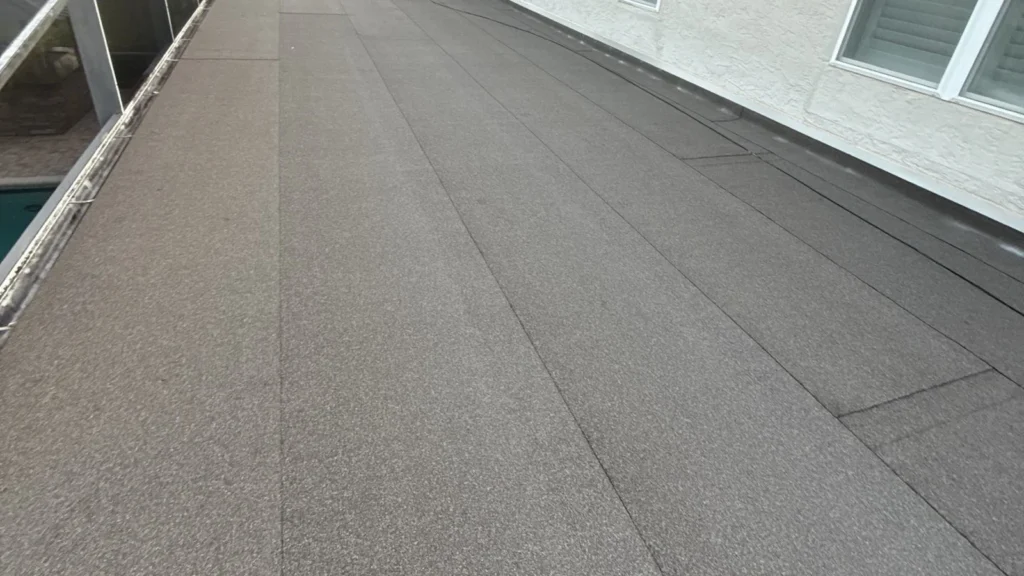 Roof-level view of the completed CertainTeed Flintlastic flat roof in Windermere