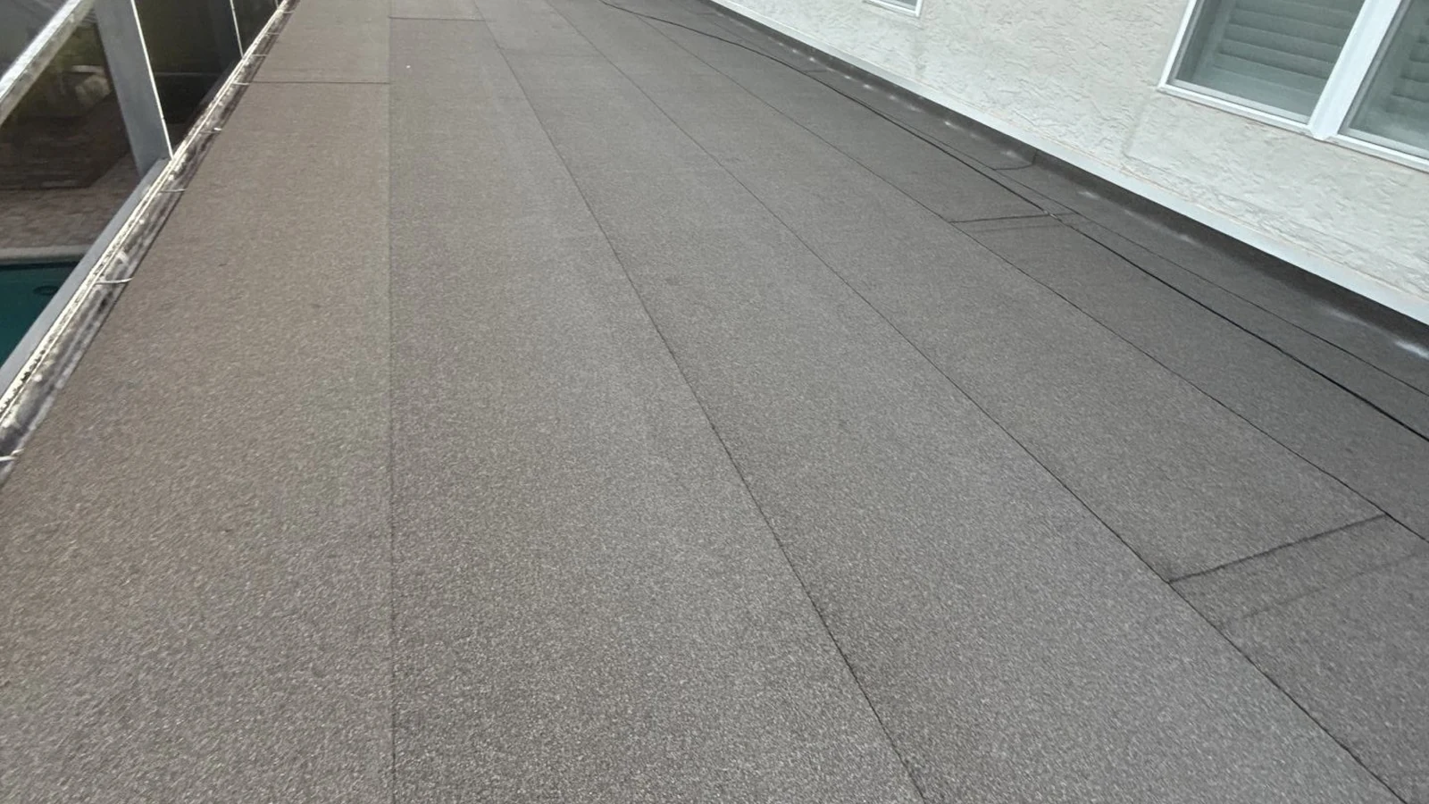 Roof-level view of the completed CertainTeed Flintlastic flat roof in Windermere
