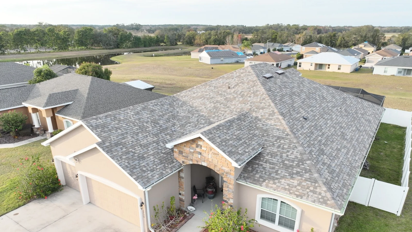 Roof-focused aerial view of the completed Owens Corning Duration roof in Winter Haven