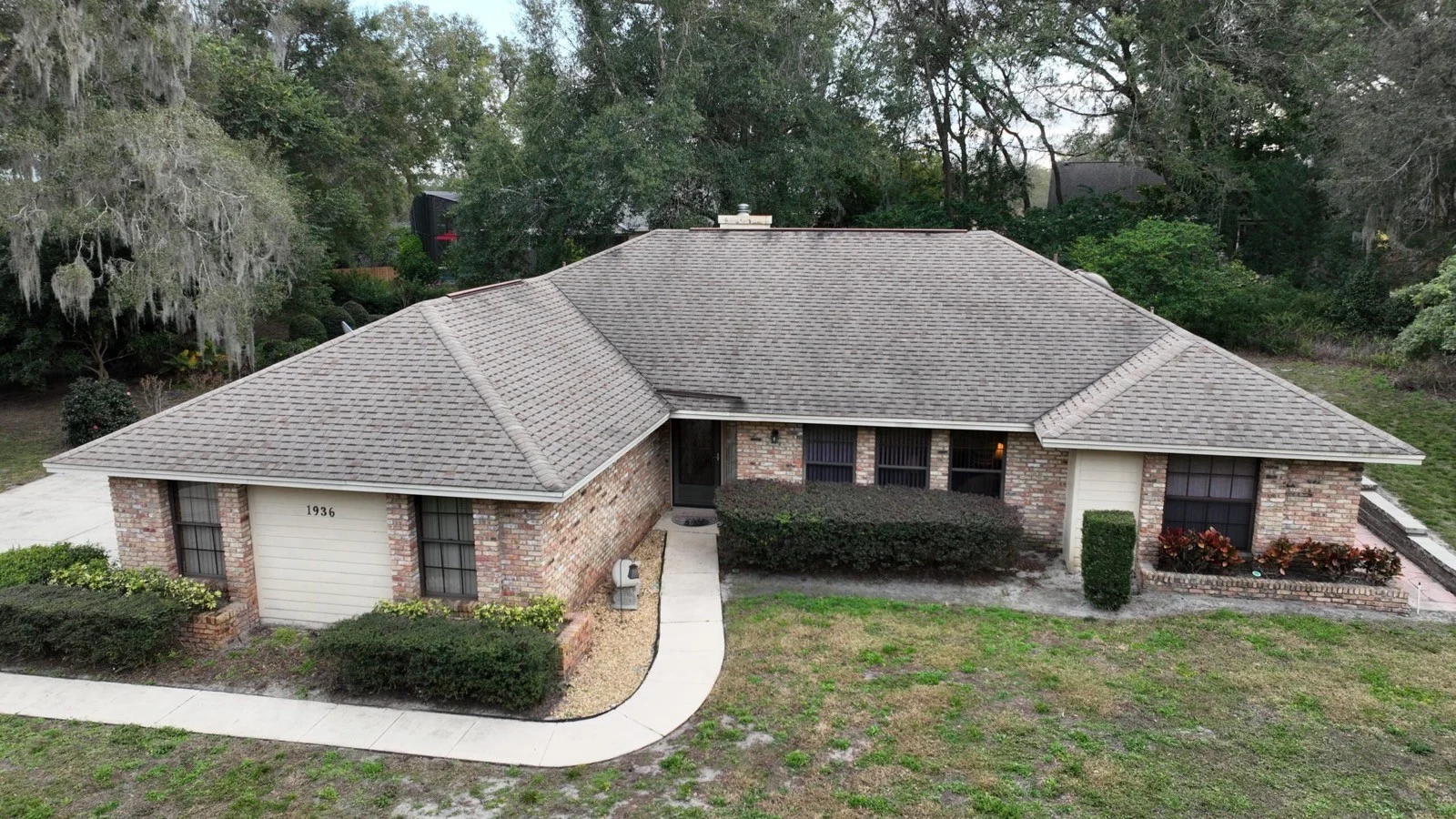 Aerial view of a Florida home with a shingle roof